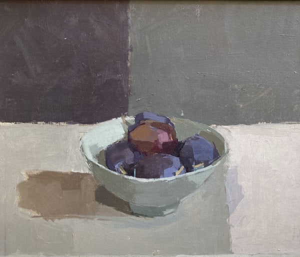 Sarah Spackman figurative still life painting of 5 deep purple plums resting in a grey bowl. The surface is painted in tones of pale greys and the background a two tone split of tteel greys and smoky greys.