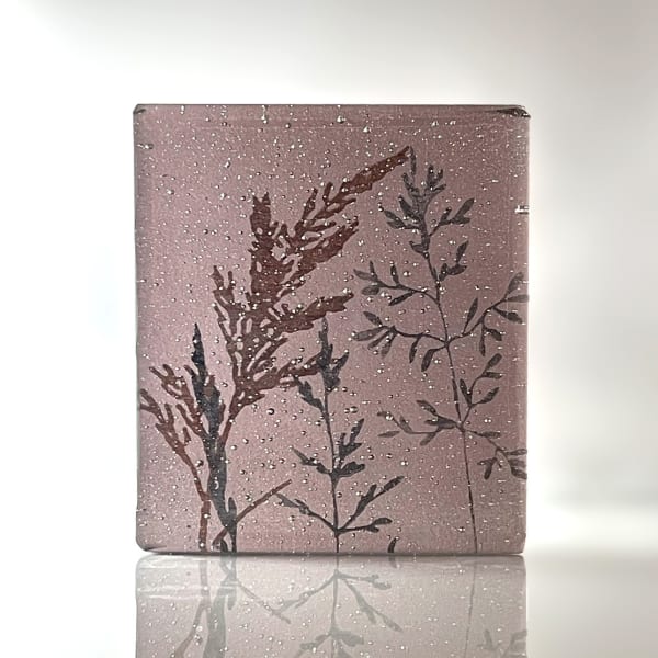 Helen Slater glass sculpture in plum with black and sepia drawings of grass