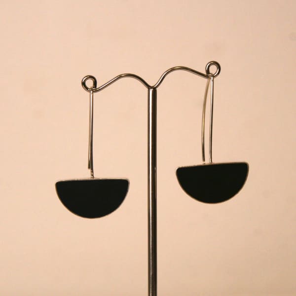 Claire Lowe resin jewellery, silver drop style earring hooks with semi-circular black resin pendant at the bottom