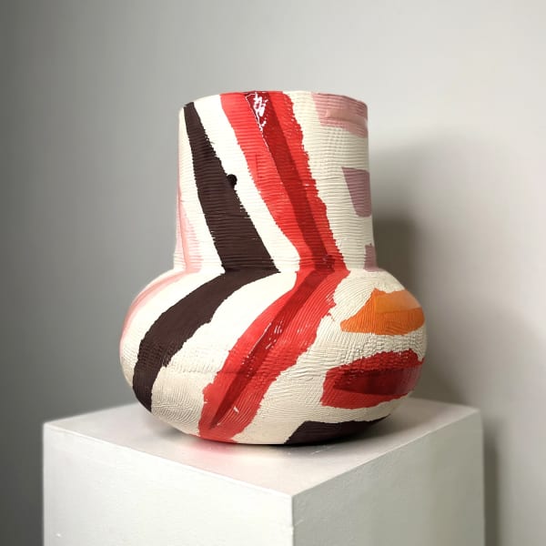 Eddie Knevett ceramic vessel designed with shaped in colours red, orange, pink and brown