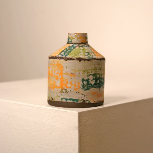 Elly Wall stoneware ceramic bottle vase with raised bumpy texture and orange, teal and sage glazes