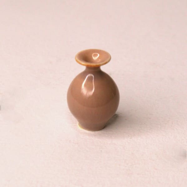 Yuta Segawa ceramic miniature vase in blush glaze, rounded bottom and short curved neck