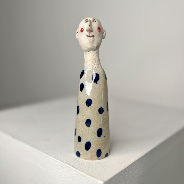 Jane Muir little man ceramic sculpture with stone grey glaze and spaced out blue dots
