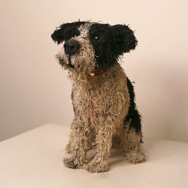 Gemma Rees mixed media sculpture of a small mixed breed terrier type dog in black and white colourway and seated position