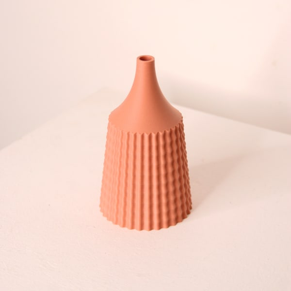 Keeley Traae 3D printed PLA Vase with a long dished neck and a spikey design on the body in Ginger