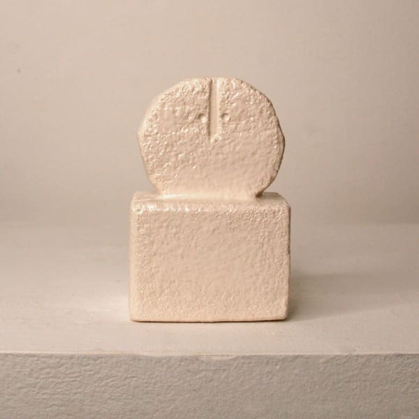 Peter Slight ceramic slip-cast bust of a circular head with abstracted face and egg shell white glaze on a plinth base