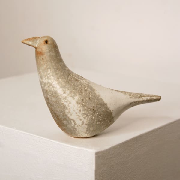 Jane Muir minimalist ceramic sculpture of a snow bird, with a speckled white matte glaze