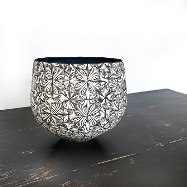 Ant & Di Edmonds of Tydd Pottery ceramic vessel is a bowl shape with a hand painted geometric flower design in black and white