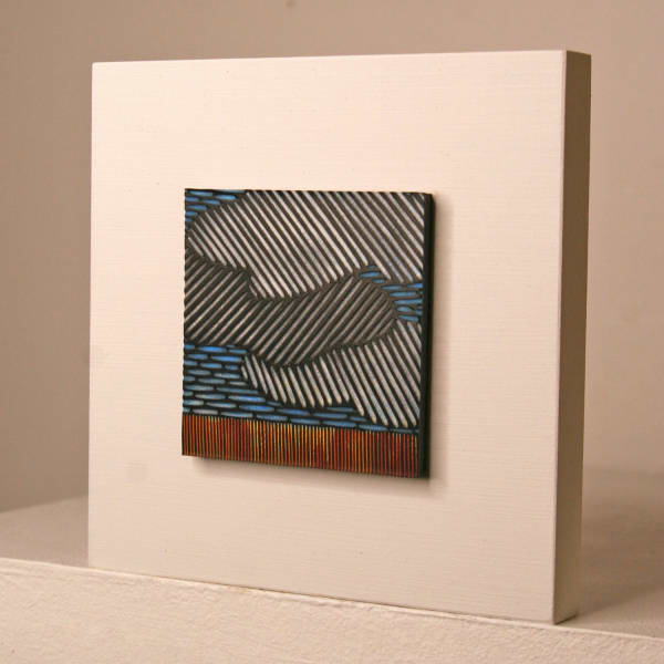 Janine Partington wooden panel with Carved leather design of a clouded landscape