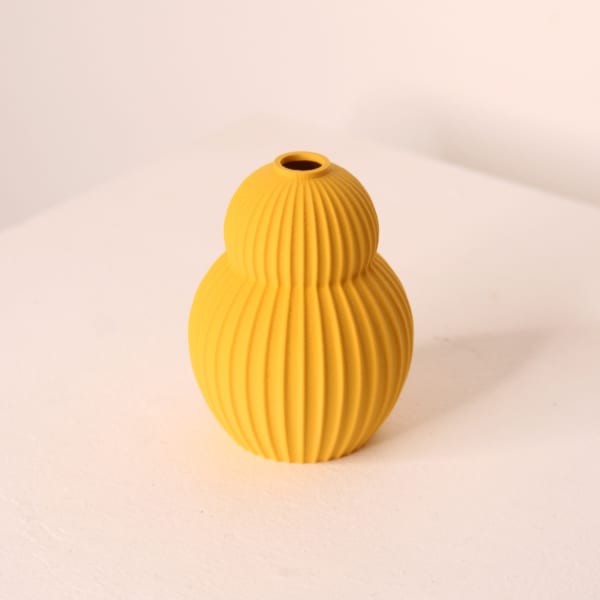 Keeley Traae PLA 3d printed rounded two tiered vase with dimensional incised line texture, custard