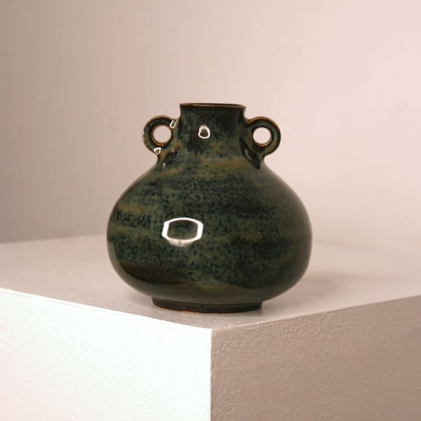 Lucy Physick stoneware ceramic small tear drop shaped vase in a speckled dark green glaze