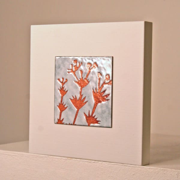 Janine Partington vitreous enamel on copper plate mounted on wooden panel with 3 stems design