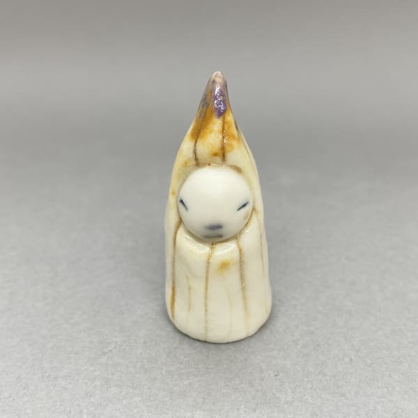 Marina Bauguil tiny sculpture inspired by Japanese kami, a yellow seedling with a lilac tip on its head.