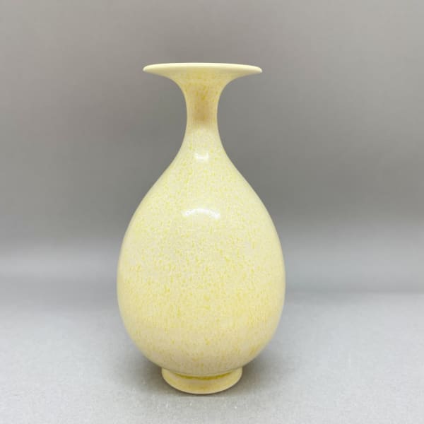 Yuta Segawa ceramic pot in a round shape and slender neck in pale yellow cream