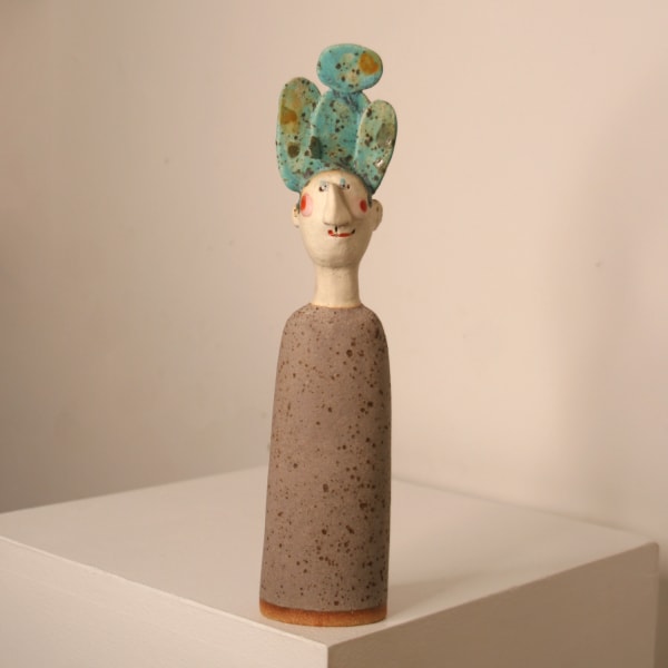 Jane Muir minimalist sculpture of a man, with a cactus tree on his head