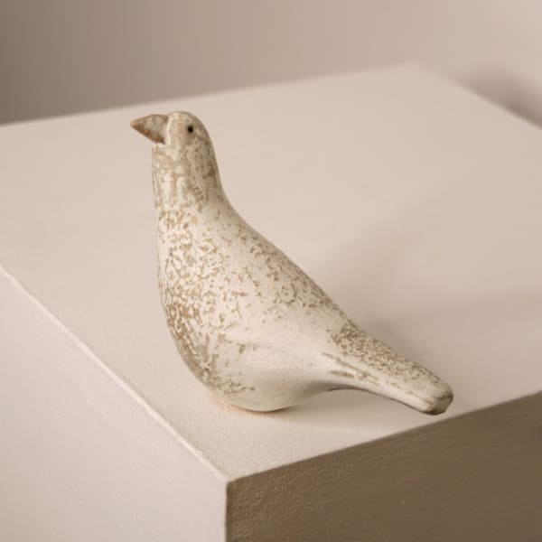 Jane Muir minimalist ceramic sculpture of a snow bird, with a speckled white matte glaze