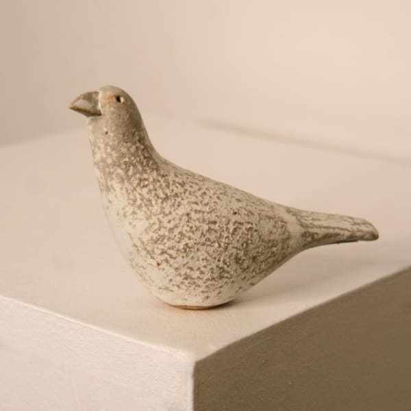 Jane Muir minimalist ceramic sculpture of a snow bird, with a speckled white matte glaze
