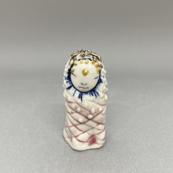 Marina Bauguil tiny sculpture of a plant spirit in the shape of a small pine cone in pink., gold detail on its head.