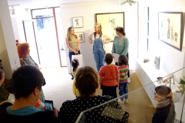 A photograph of Sarah Wiseman Gallery interior, as Sarah Wiseman announces winners of a children's art competition