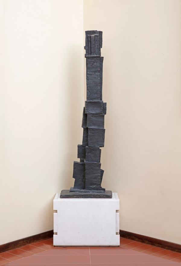 A bronze sculpture of an abstract form.