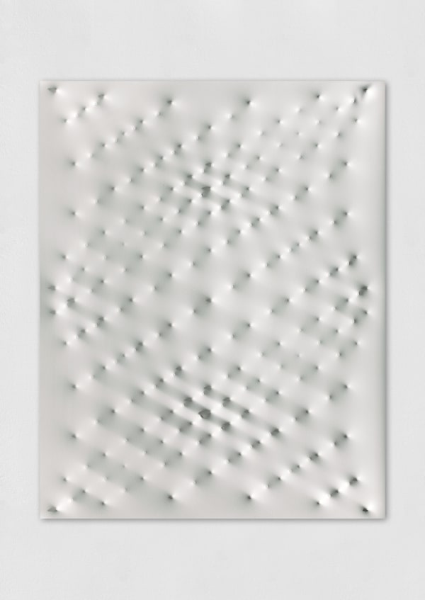 An acrylic white wall sculpture made by placing nails under the canvas to create an undulating pattern.