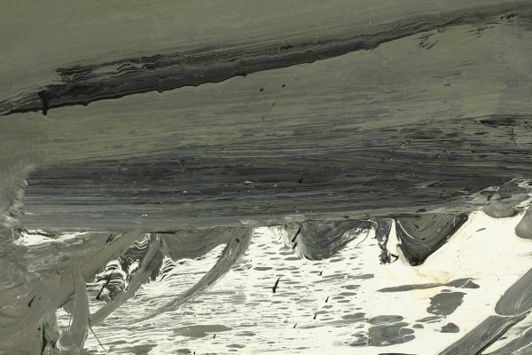 A detail of an oil on canvas abstract grey painting with white and black highlights.