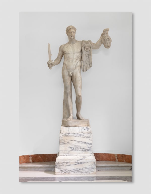 A Pentelic marble sculpture depicting the mythological story of Perseus beheading Medusa.