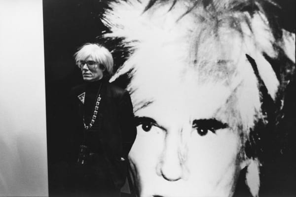 Andy Warhol at the opening of his Self-Portraits exhibition, Anthony d’Offay Gallery, London, July 1986. Photograph by John Wildgoose. © John Wildgoose / The Andy Warhol Foundation for the Visual Arts.