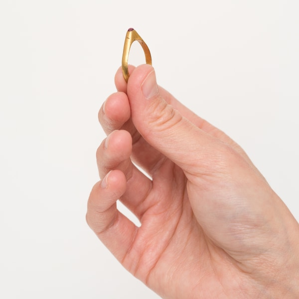 Stirrup Ring with Garnet in hand