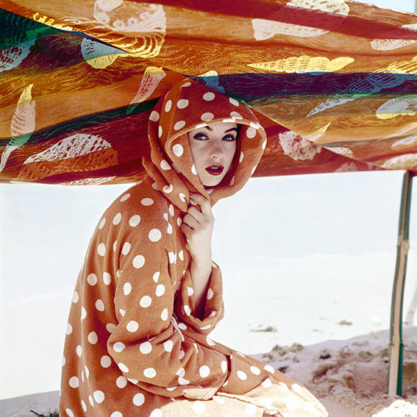 A fashion model wearing clothes by Lanvin-Castillo is photographed for the cover of Vogue magazine, 1957