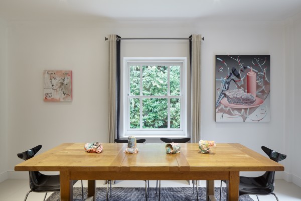 Left to right: Painting by France-Lise McGurn, sculptures on table by Rosie Reed and painting by Jane Hayes Greenwood.