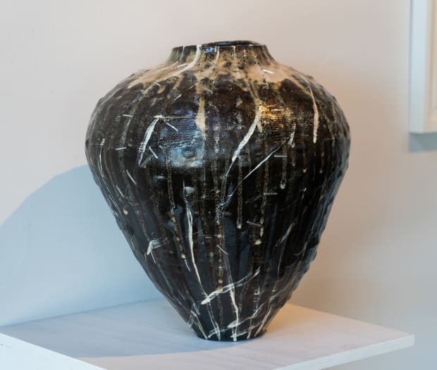 'While the clay body is a commercial product the slips and glazes are ones that I have made myself using...