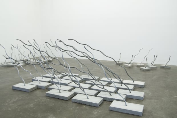 Each day holds the possibility for change-- here rope is looped and knotted to form hanging skeletal structures, newspaper is...