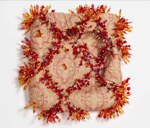 Sahlah Davids was born in 1998 in Cape Town. Delving into the mediums of textiles and beadwork, mixed media artist...