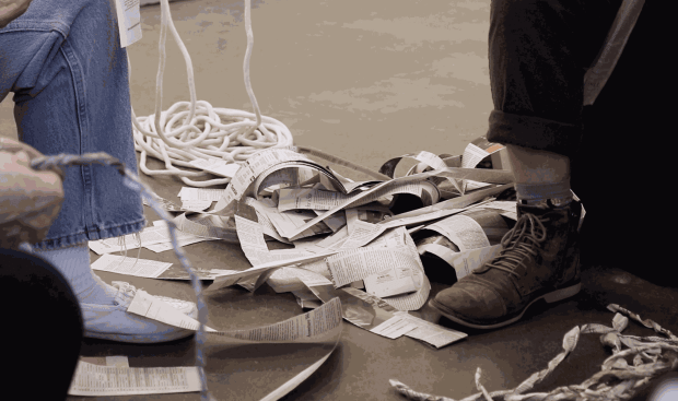 Feet and torn newspaper at twisting session