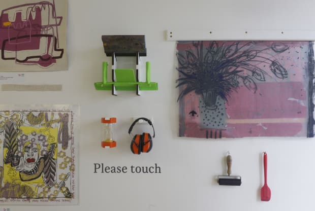 The exhibition also includes a tactile feature displaying items that make printing more accessible and are often used by the...