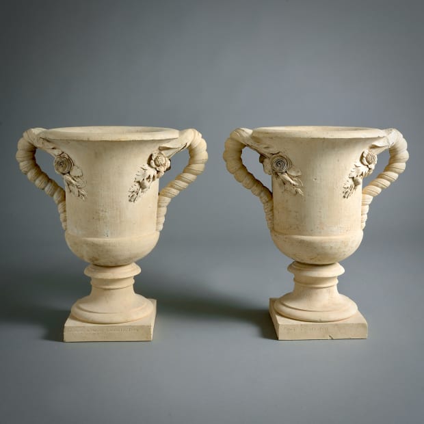 A RARE AND POSSIBLY UNIQUE PAIR OF REGENCY COADESTONE VASES, 1808. Signed and dated COADE & SEALY 1808. 22in. (56cm)...