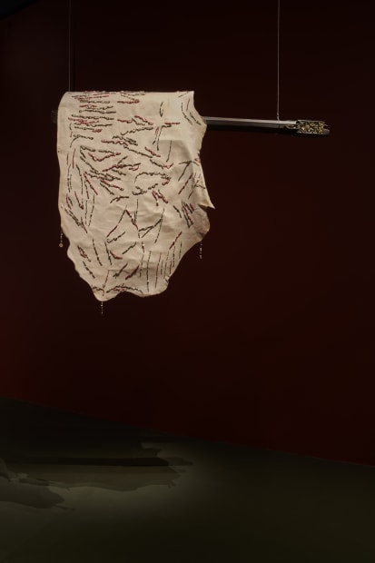 Prologue, 2024, Beaded cow hides hung on antique wooden pillars with aluminium saddles, Dimensions variable.