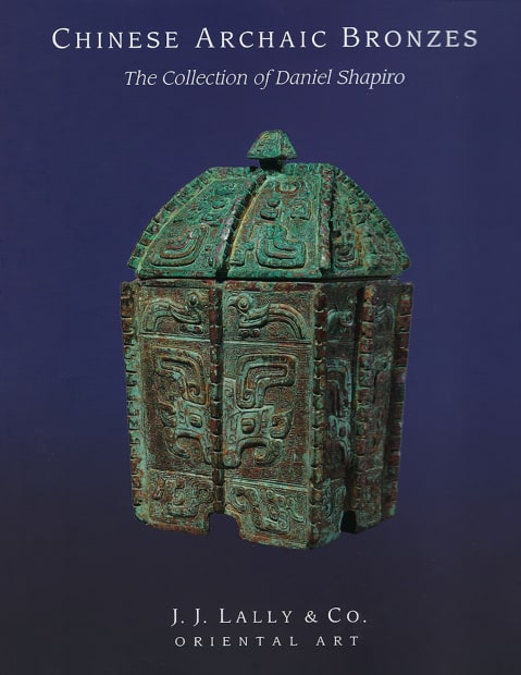 Chinese archaic bronzes book cover of a blue background and bronze sculpture. 