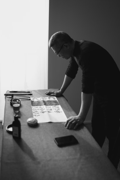 Fung Ming Chip is practicing calligraphy