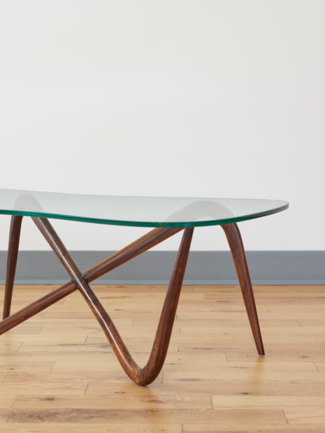 COFFEE TABLE, 1955 Designed in 1955, this coffee table by Joaquim Tenreiro reveals his command of structure and proportion. The...