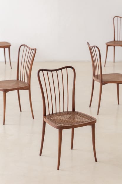 DINING CHAIRS WITH STICKS BACKS, 1948 This set of eight exquisitely crafted Cane Chairs in Amendoim Wood, designed by Joaquim...