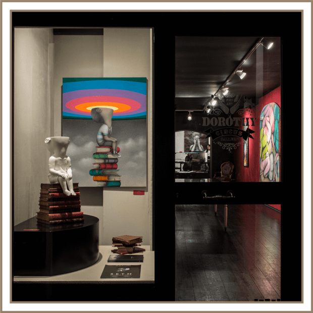 Window of Dorothy Circus Gallery showing a painting and sculpture by SETH
