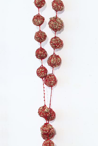 Intentions, Gilded tea leaves wrapped in red string