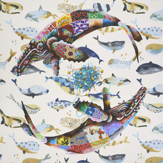 two humpback whales in a circle over a background of varied fish