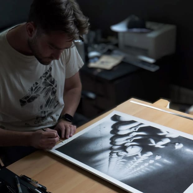 Artist Miles Johnston in the studio