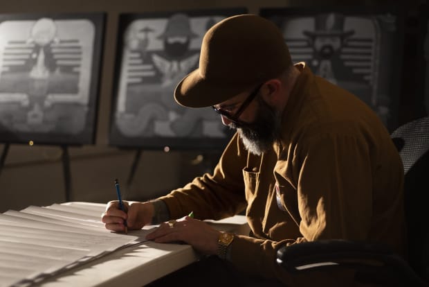 Portrait of Jeremy Fish in his studio drawing