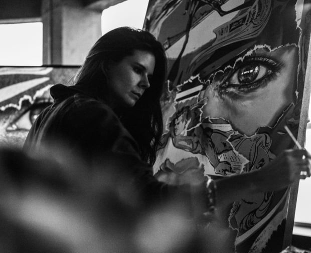 Portrait of the artist Sandra Chevrier working in her studio.