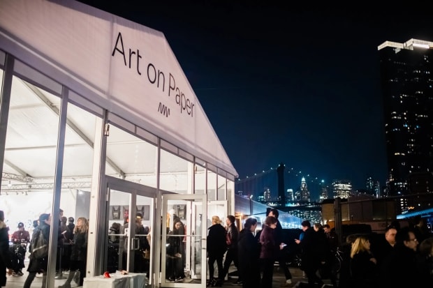 photograph of attendees outside of art on paper