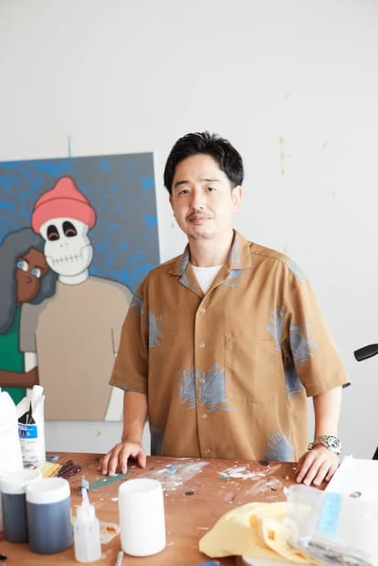 Portrait of artist Jun Oson in his studio space